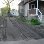 Project complete, installed crushed asphalt and leveled the topsoil along the drive.